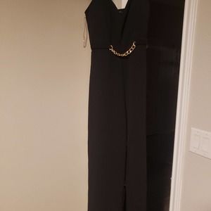 Iris Black pant jumpsuit with a gold chain in the front